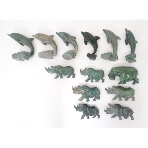 812 - A quantity of carved soapstone animals to include dolphins and rhinos. Largest approx. 4 1/4
