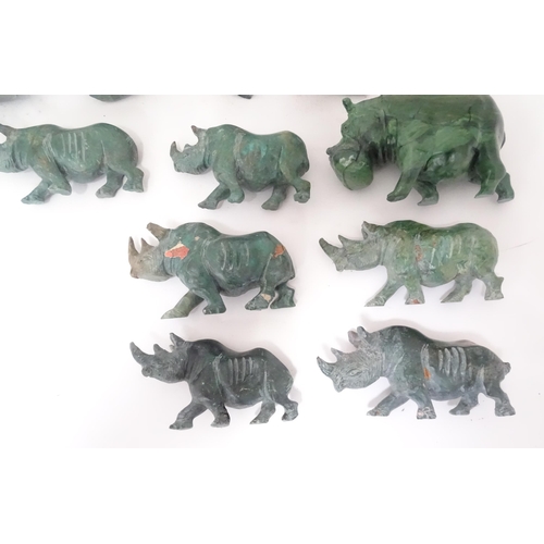 812 - A quantity of carved soapstone animals to include dolphins and rhinos. Largest approx. 4 1/4