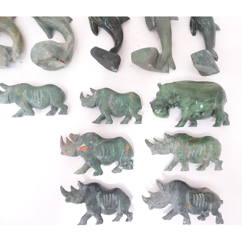 812 - A quantity of carved soapstone animals to include dolphins and rhinos. Largest approx. 4 1/4