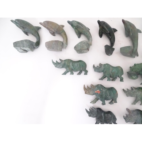 812 - A quantity of carved soapstone animals to include dolphins and rhinos. Largest approx. 4 1/4