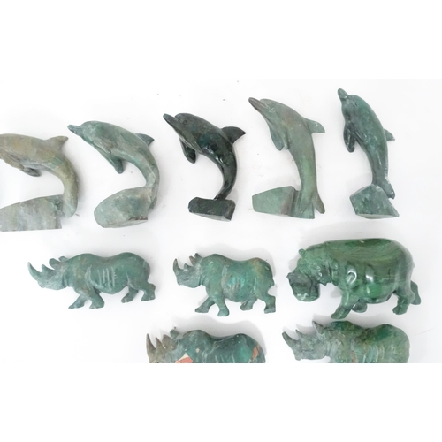 812 - A quantity of carved soapstone animals to include dolphins and rhinos. Largest approx. 4 1/4