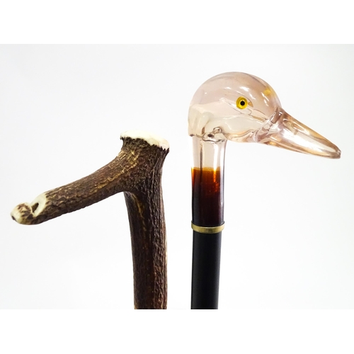 829 - A quantity of walking sticks / canes, comprising a hazel stick with antler handle and whistle tip, a... 