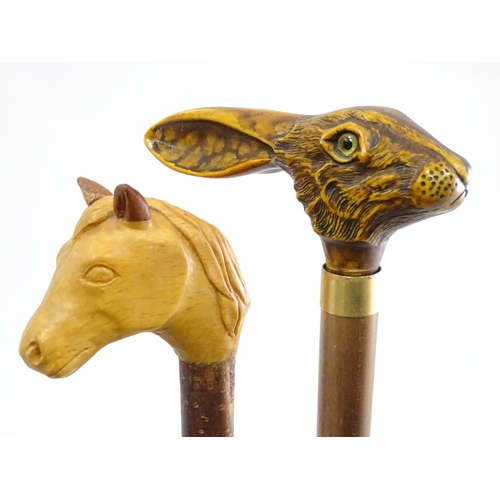 829 - A quantity of walking sticks / canes, comprising a hazel stick with antler handle and whistle tip, a... 