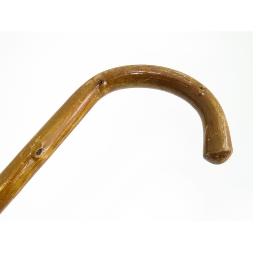 829 - A quantity of walking sticks / canes, comprising a hazel stick with antler handle and whistle tip, a... 