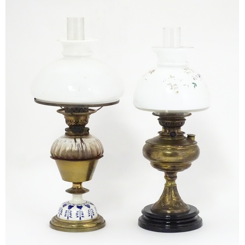 851 - Two late 19thC / early 20thC oil lamps, one with glass reservoir. Tallest approx. 23