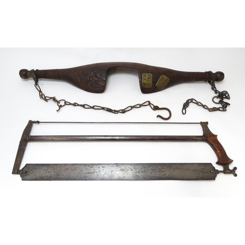 872 - A 19thC carved shoulder yoke, together with a late 19thC bow saw with a mahogany handle stamped '712... 