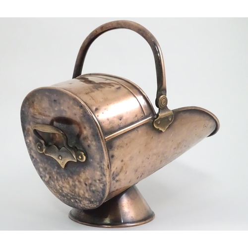 334 - An early 19thc copper coal scuttle, with swing handle and stamped '16' to the back, together with a ... 