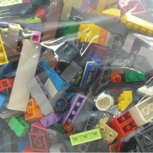 338 - A quantity of Lego to include bricks, wheels and figures etc.