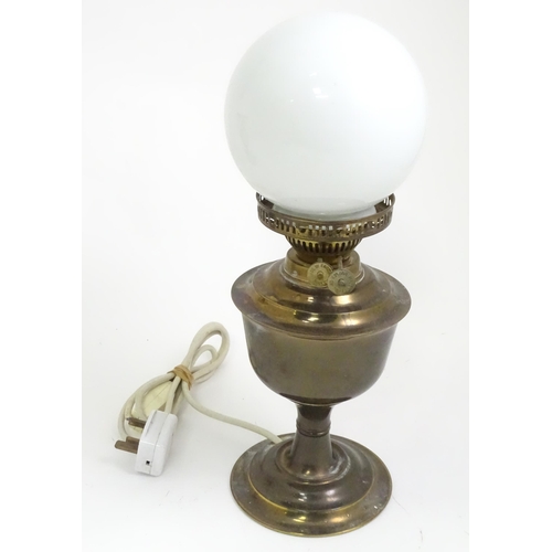 391 - A quantity of assorted table lamps, to include examples of oil lamp form, one formed as a Corinthian... 