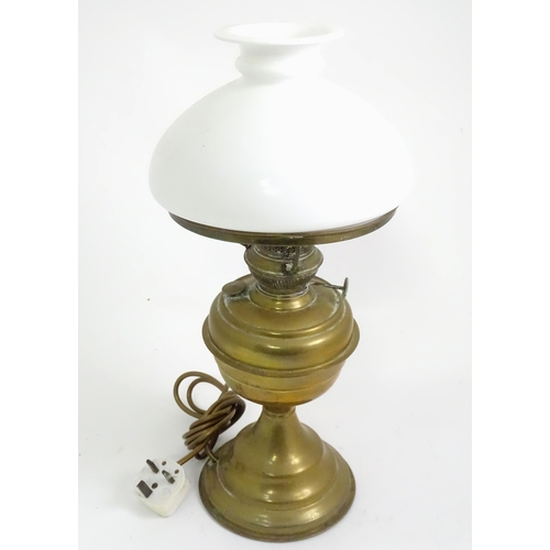 391 - A quantity of assorted table lamps, to include examples of oil lamp form, one formed as a Corinthian... 