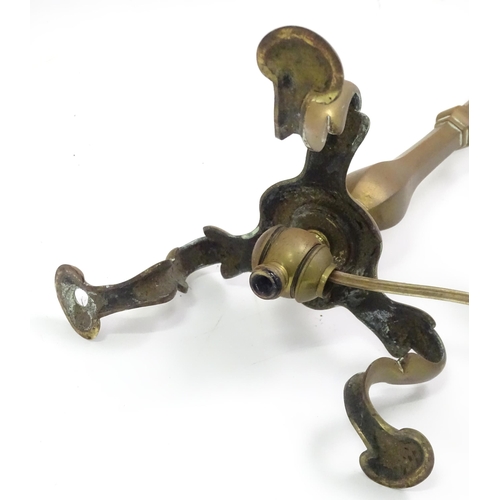 391 - A quantity of assorted table lamps, to include examples of oil lamp form, one formed as a Corinthian... 