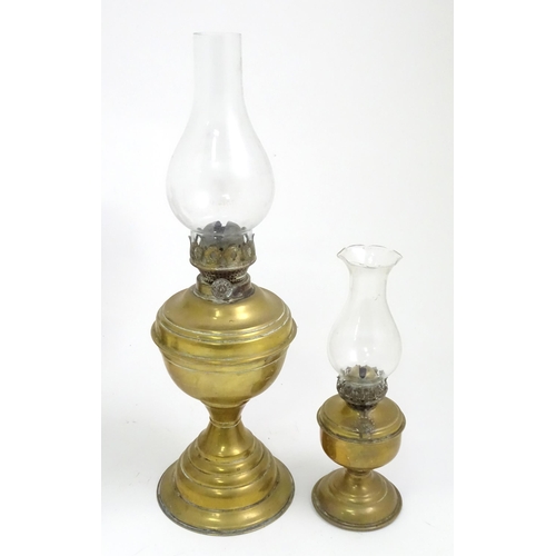 391 - A quantity of assorted table lamps, to include examples of oil lamp form, one formed as a Corinthian... 
