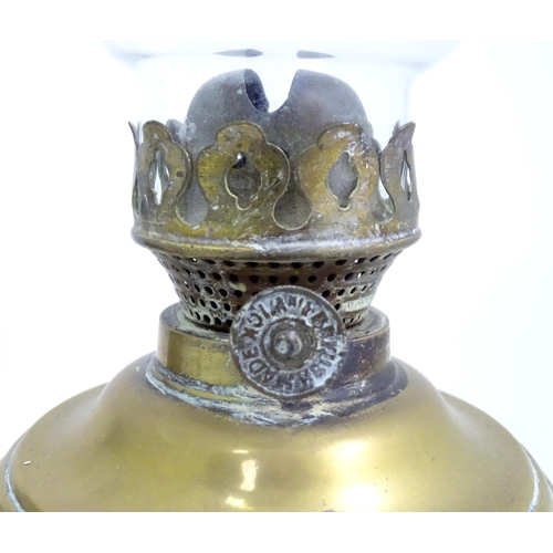 391 - A quantity of assorted table lamps, to include examples of oil lamp form, one formed as a Corinthian... 