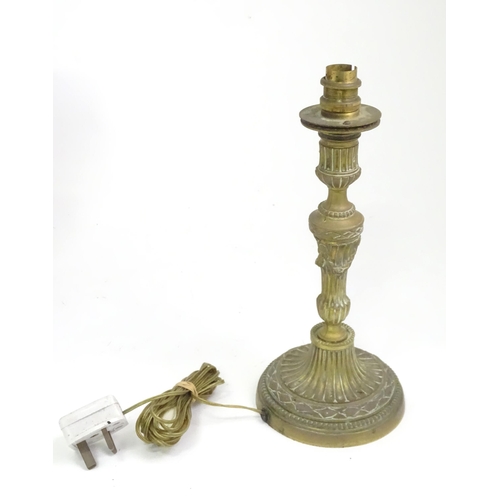 391 - A quantity of assorted table lamps, to include examples of oil lamp form, one formed as a Corinthian... 