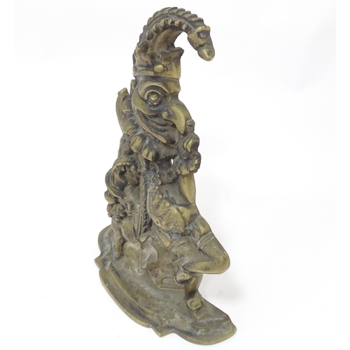 408 - A cast door stop / door porter modelled as Mr Punch and Toby the dog. Approx. 11 1/2