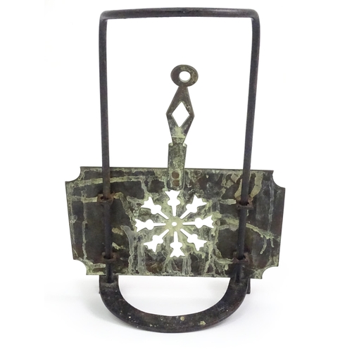 419 - A Victorian brass and cast iron sliding fireside trivet with hanging hooks and pierced detail. Appro... 
