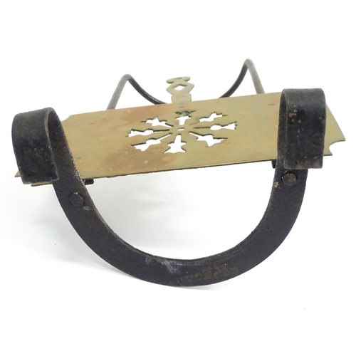 419 - A Victorian brass and cast iron sliding fireside trivet with hanging hooks and pierced detail. Appro... 