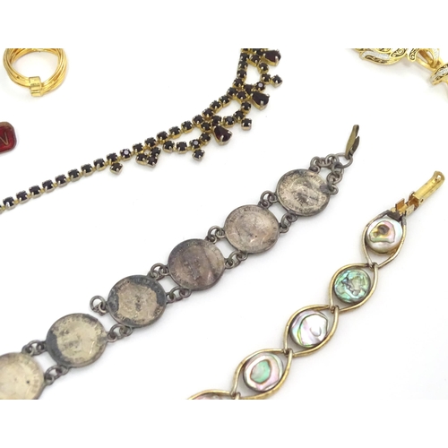 602 - A quantity of assorted costume jewellery to include a three strand bead necklace, a necklace with fa... 