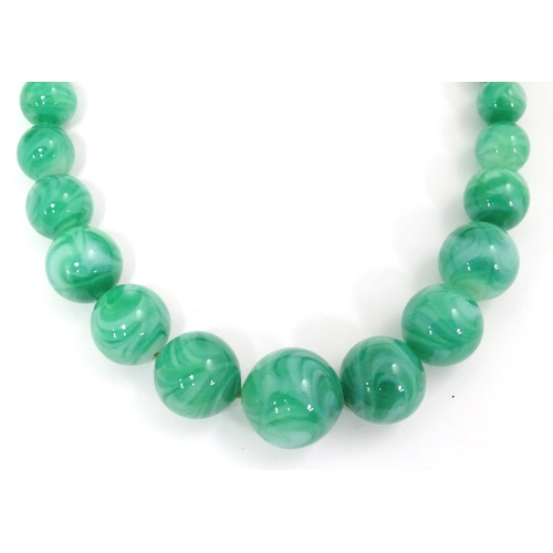 602 - A quantity of assorted costume jewellery to include a three strand bead necklace, a necklace with fa... 