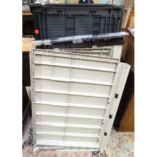 666 - A Keter outdoor storage box, disassembled, the largest section approx 57
