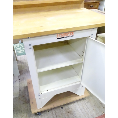 671 - Workshop Tools : an Axminster single workbench, the metal base with locking cupooard and two shelves... 