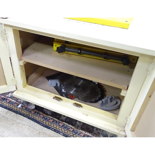 676 - Workshop Tools : a Perform 170mm bandsaw, with cupboard base containing accessories, spare blades et... 