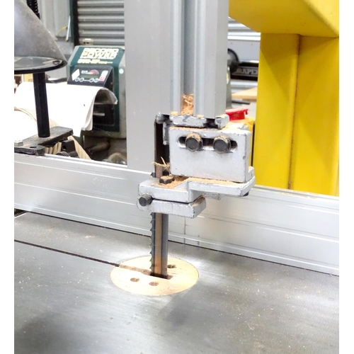 676 - Workshop Tools : a Perform 170mm bandsaw, with cupboard base containing accessories, spare blades et... 