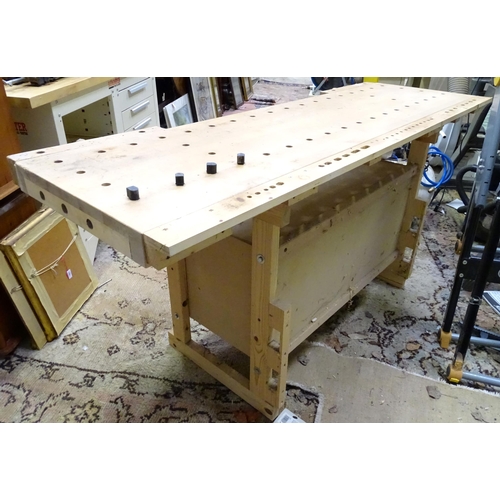 679 - Workshop Tools : A Sjobergs double workbench fitted with two vices. The base with shelf, cupboard an... 