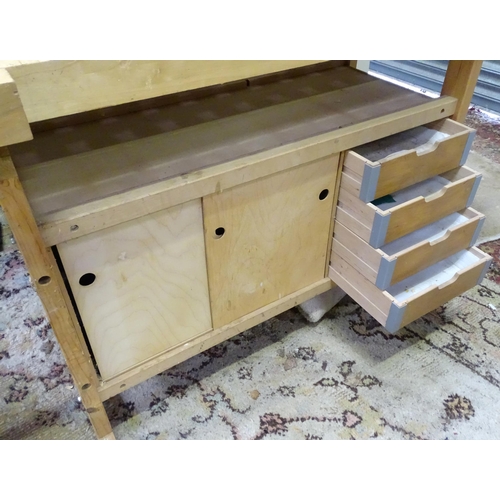 679 - Workshop Tools : A Sjobergs double workbench fitted with two vices. The base with shelf, cupboard an... 