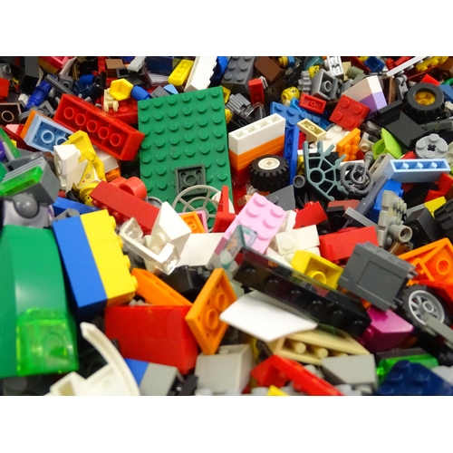 886 - A quantity of Lego to include bricks, wheels and figures etc.