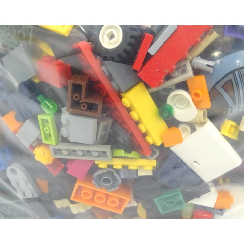 886 - A quantity of Lego to include bricks, wheels and figures etc.