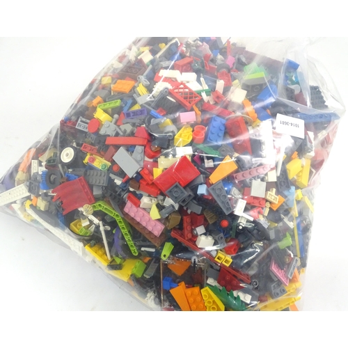 886 - A quantity of Lego to include bricks, wheels and figures etc.