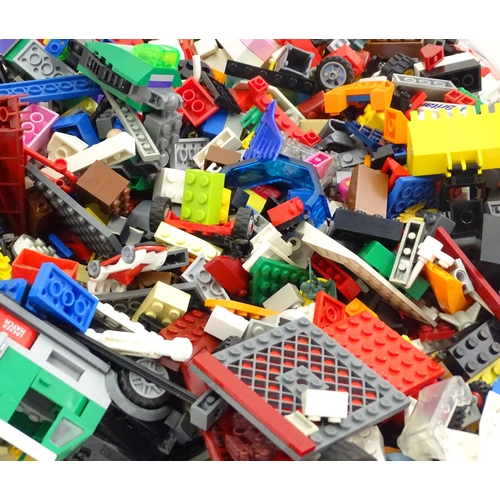 886 - A quantity of Lego to include bricks, wheels and figures etc.