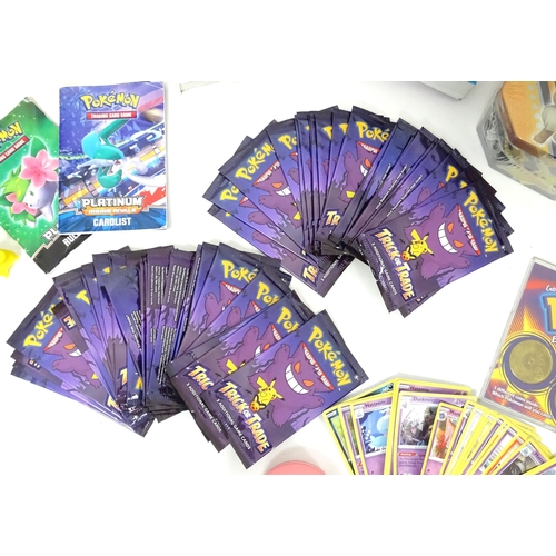626 - A quantity of assorted Pokemon toys / collectables, to include cards, story books , handbook, encycl... 