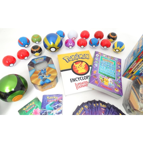 626 - A quantity of assorted Pokemon toys / collectables, to include cards, story books , handbook, encycl... 