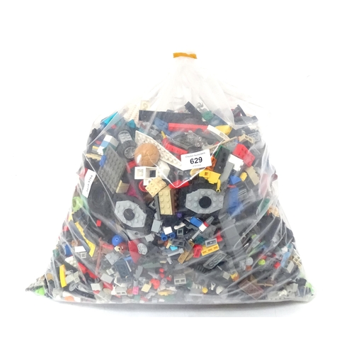 629 - A quantity of Lego to include bricks, wheels and figures etc.