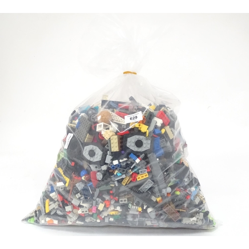 629 - A quantity of Lego to include bricks, wheels and figures etc.