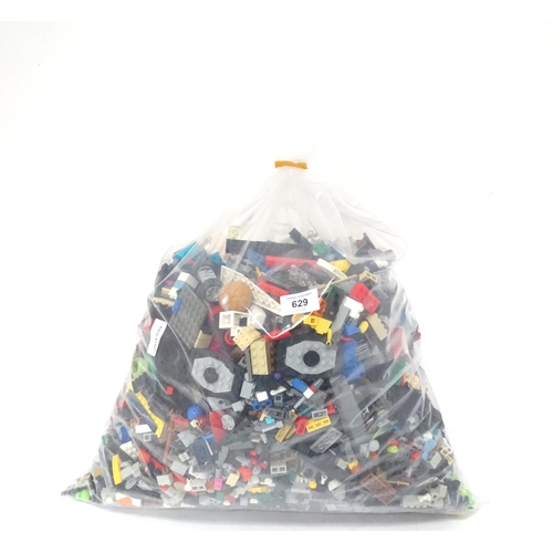629 - A quantity of Lego to include bricks, wheels and figures etc.