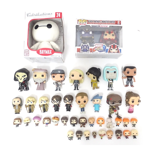 654 - Collectors toys : A quantity of Funko POP! toys to include a boxed Baymax, a boxed Black Panther vs ... 