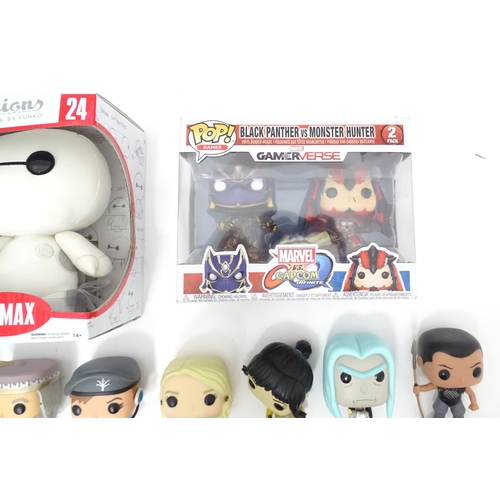 654 - Collectors toys : A quantity of Funko POP! toys to include a boxed Baymax, a boxed Black Panther vs ... 
