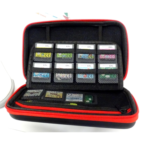 673 - Toys: Two Nintendo Wii games consoles and accessories to include Wii controllers, balance board, var... 