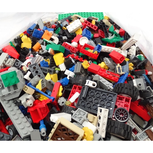 674 - Toys: A quantity of Lego to include bricks, wheels and figures etc.
