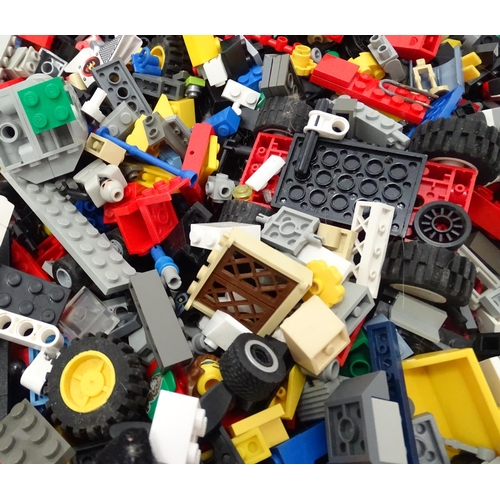 674 - Toys: A quantity of Lego to include bricks, wheels and figures etc.