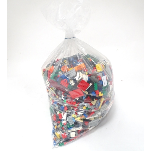 674 - Toys: A quantity of Lego to include bricks, wheels and figures etc.