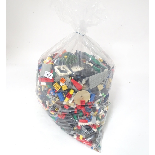 674 - Toys: A quantity of Lego to include bricks, wheels and figures etc.