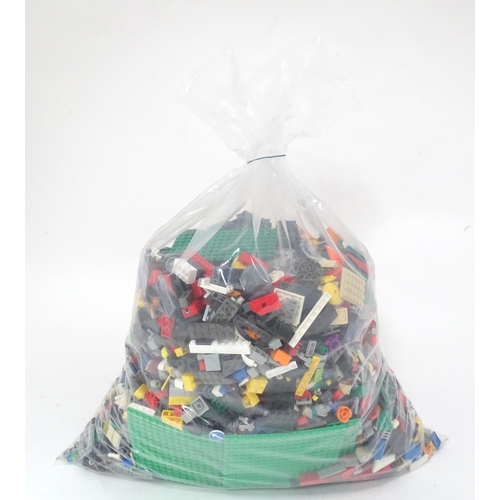 674 - Toys: A quantity of Lego to include bricks, wheels and figures etc.