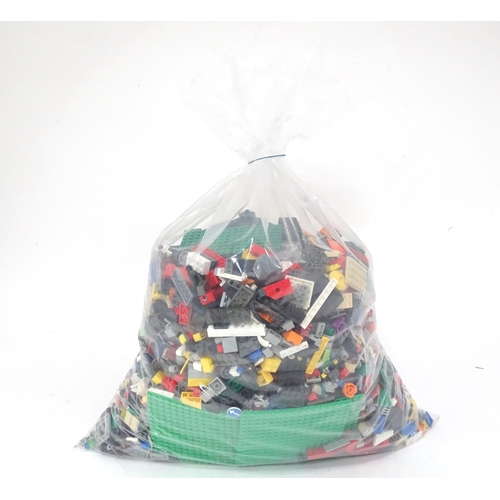 674 - Toys: A quantity of Lego to include bricks, wheels and figures etc.