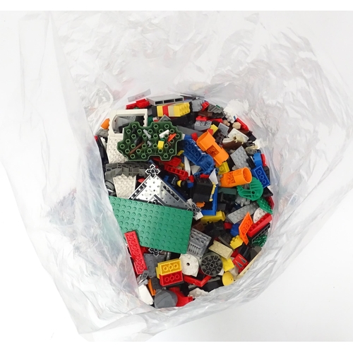674 - Toys: A quantity of Lego to include bricks, wheels and figures etc.