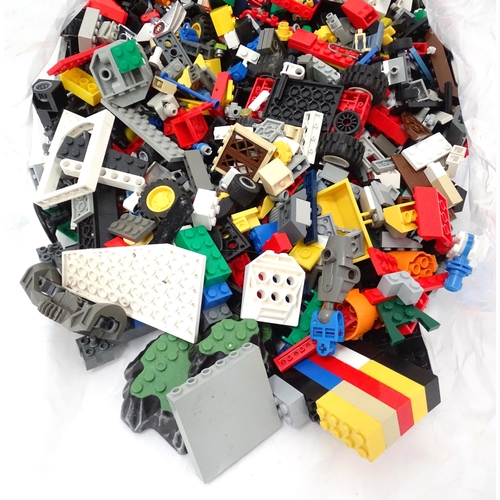674 - Toys: A quantity of Lego to include bricks, wheels and figures etc.