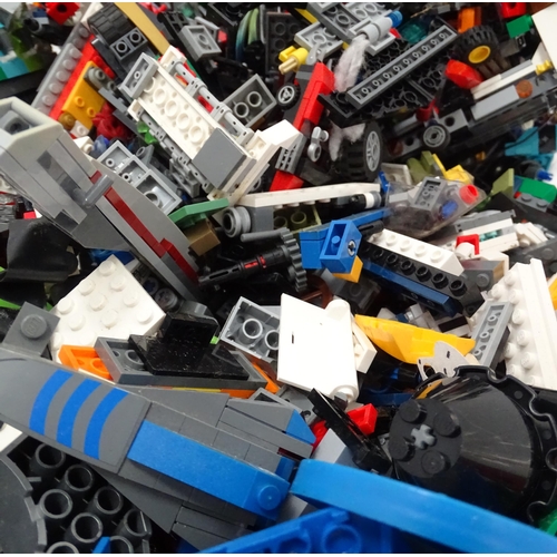 694 - A quantity of Lego to include bricks, wheels and figures etc.